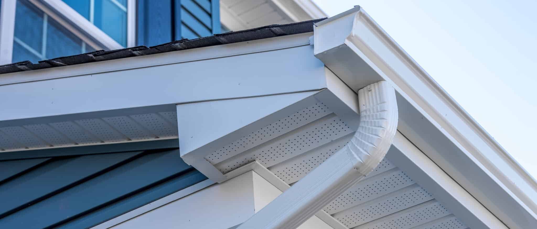 Close-up on K-style gutter on a white house.