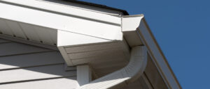 Close-up on K-style gutter on a white house.