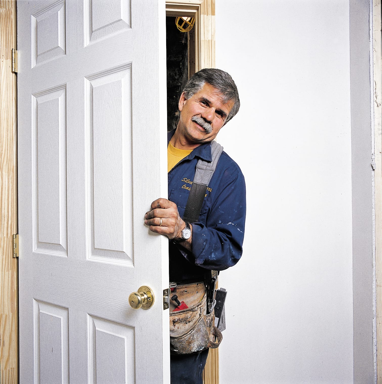 Photo of Tom Silva during the installation process for a prehung door