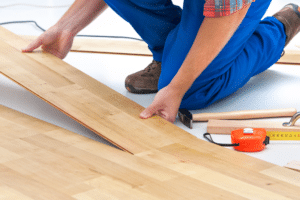Person laying down laminate flooring